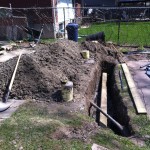 Storage shed piers and retaining wall