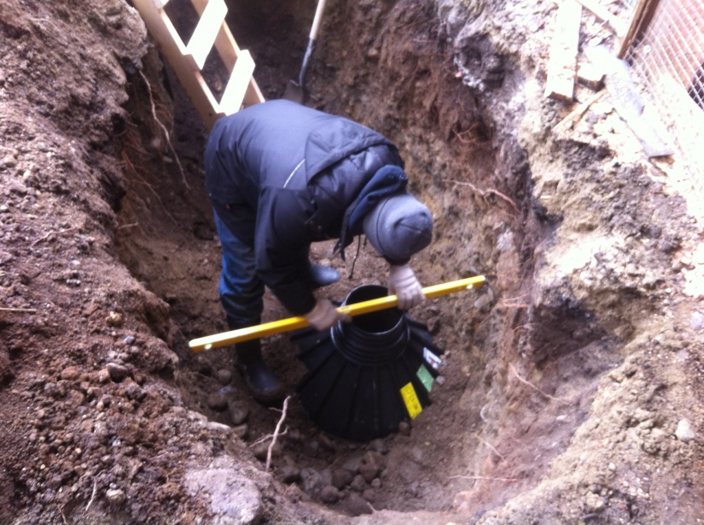 Excavating and setting footings 5 feet below grade